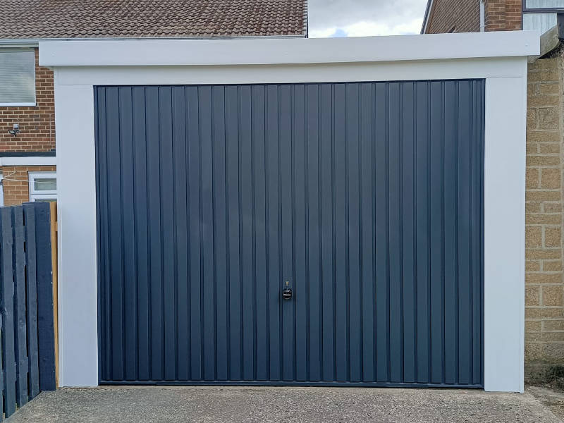 Grey Garage Door with White Trim